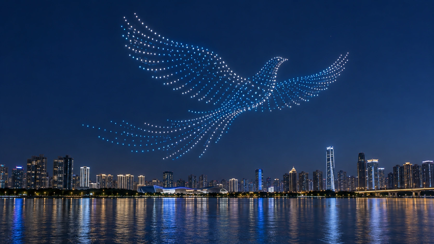 城市滨水夜景上空鸟形灯光编队的生成场景示意